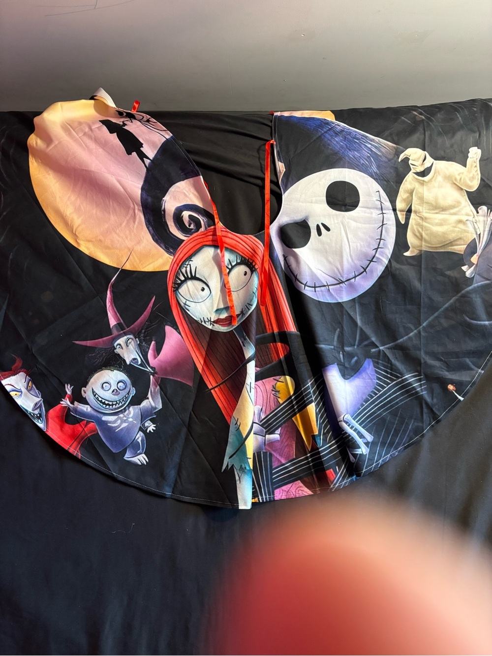 Nightmare-Inspired tree skirt in Black with Colorful Characters